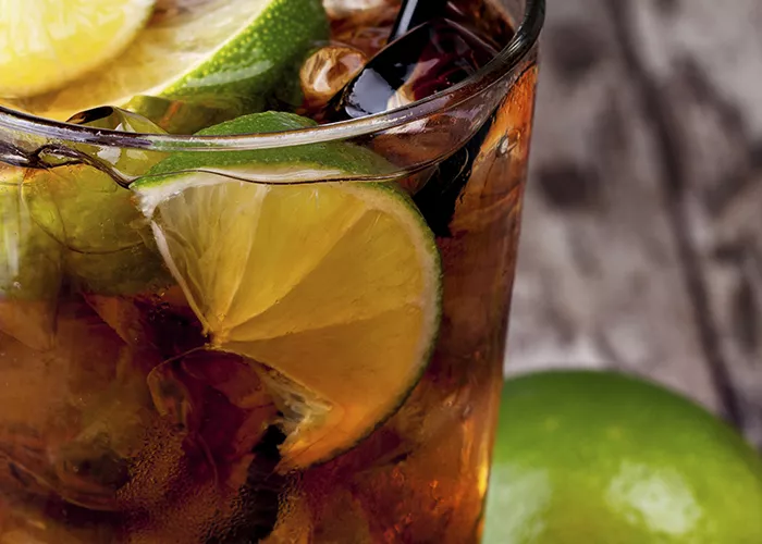 Image of glass filled with cuba libre and lots of fruit