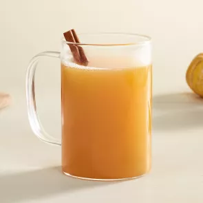 Mug of Cruzan® Spiced Apple Cider garnished with cinnamon stick