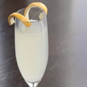 Glass of Glasgow Seelbach garnished with lemon peel