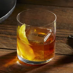 A glass of  Knob Creek® Rye Old Fashioned garnished with Lemon Peel a