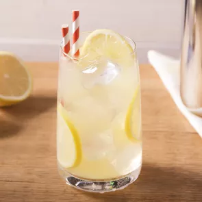 Glass of Vodka Lemonade garnished with lemon slices