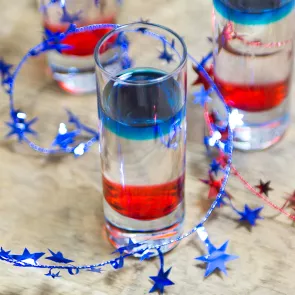 Glass of Red, White, and Blue Shot with some decoration 