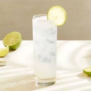 A glass of Sauza® Mexican Paloma garnished with Lime Wheel