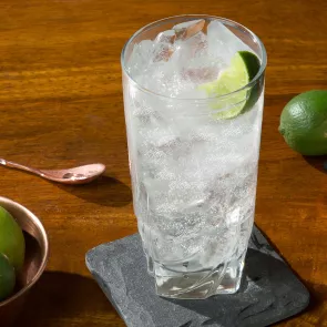 A glass of Sipsmith® Gin and Tonic garnished with Lime Wedge