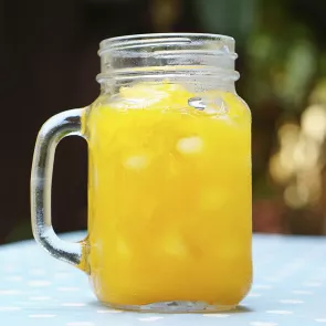 A glass of Banana Nana garnished with  banana slices