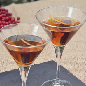 two glasses of liquid on a table