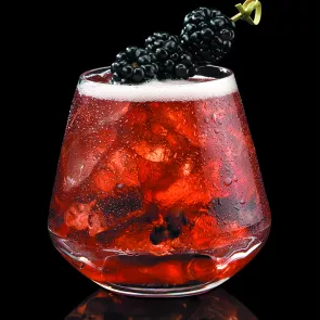 Glass of After Midnight in Kentucky garnished with Blackberries