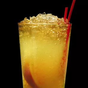 Glass of borubon squash with crushed ice and straws