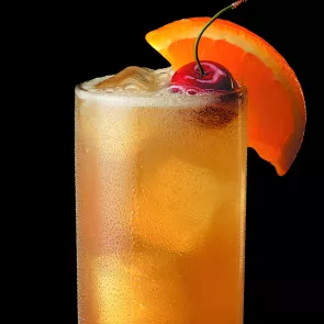 Glass of Maker's Mark® Collins garnished with an orange slice and Maraschino cherries.