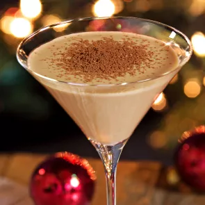 Glass of Chocolate Martini garnished with chocolate powder.