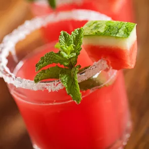  100% 11 C38  Glass of Watermelon Margarita garnished with mint leaves and watermelon slice, also rimmed with salt      	 Glass of Watermelon Margarita garnished with mint leaves and watermelon slice, also rimmed with salt Turn on screen reader support   To enable screen reader support, press Ctrl+Alt+Z To learn about keyboard shortcuts, press Ctrl+slash2 collaborators have joined the document.